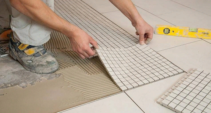 Paul laying with tiles